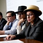 Congress members deliberating over a document in Comic Sans font