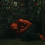 Satan clutching a Bang Energy drink on a bathroom floor